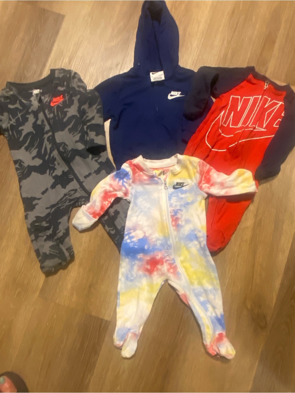 3 Nike Kids Tie-Dye Zip Front Footed One-Piece and 1 navy Nike Zip-Up Jacket